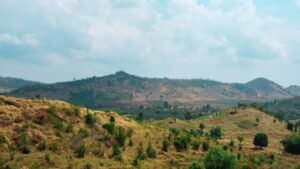 Beautiful view of rolling hills under a bright sky in Cambodia, showcasing natural beauty and tranquility.