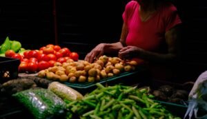 Colorful display of fresh vegetables at a market in Ibagué, Colombia, showcasing local produce.