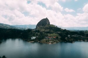 Stunning aerial view of the iconic El Peñol rock and surrounding landscape in Guatapé, Colombia.