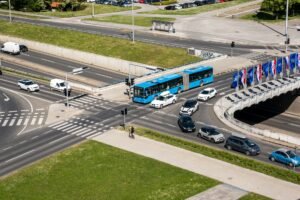 Aerial shot of a bustling traffic intersection with cars and a bus in Zagreb, Croatia.