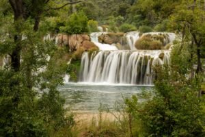 Stunning natural cascades in Krka National Park, showcasing lush greenery and tranquil waters.