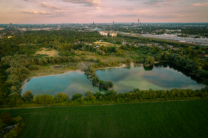 Drone shot of a lush nature preserve with ponds near Cologne, Germany.