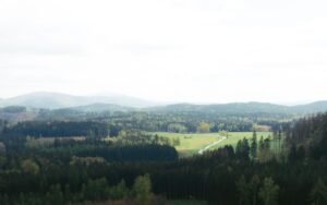 Aerial view of the lush landscapes and forested areas at Zittau Mountains Nature Park in Germany.