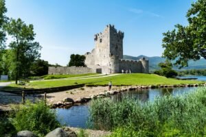 Stunning view of Ross Castle by the lakeside in Killarney, Ireland.