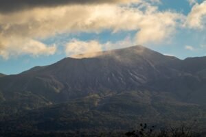 A breathtaking view of Rincon de la Vieja volcano under dramatic clouds in Guanacaste, Costa Rica.