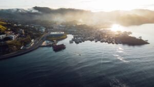 A beautiful aerial view of Port Moresby at sunrise, showcasing coastal landscapes and urban areas.