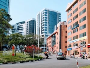 Vibrant cityscape of Kigali showcasing modern high-rise buildings on a sunny day.