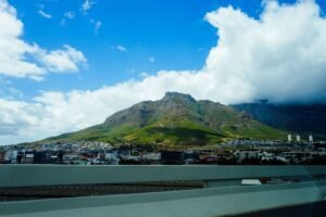 Stunning landscape of Cape Town's iconic Table Mountain under a bright blue sky.