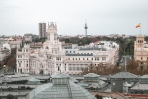 Captivating aerial view of the iconic Palacio de Cibeles and Madrid cityscape, Spain.
